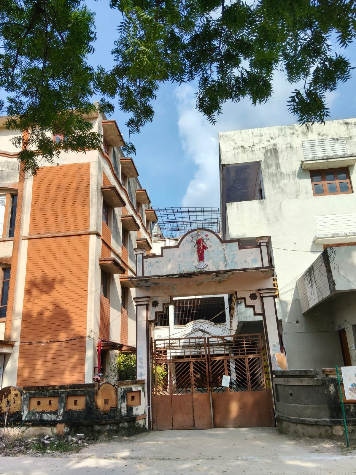 Campus entrance gate with Goddess Saraswati emblem