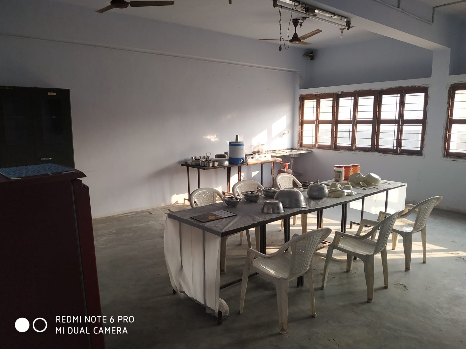 Home science practical training room with utensils laid out on a table