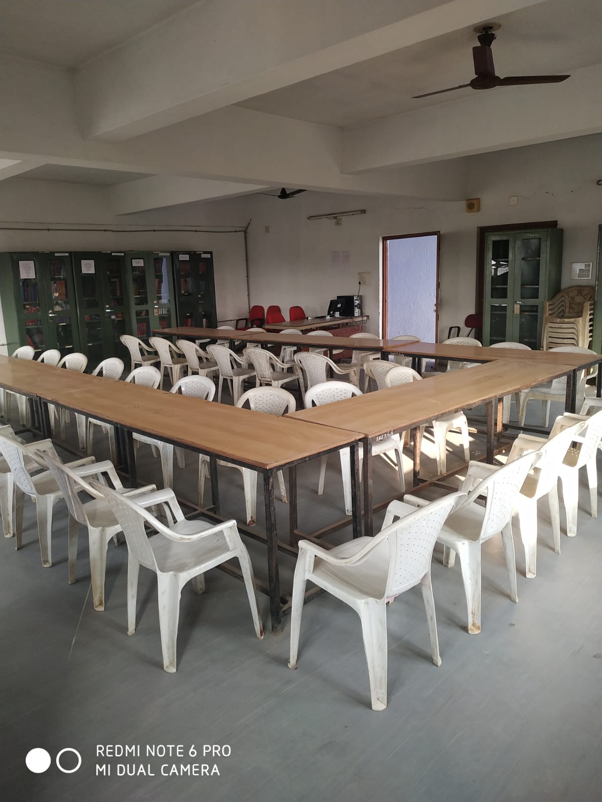 Library reading room with tables and book cabinets